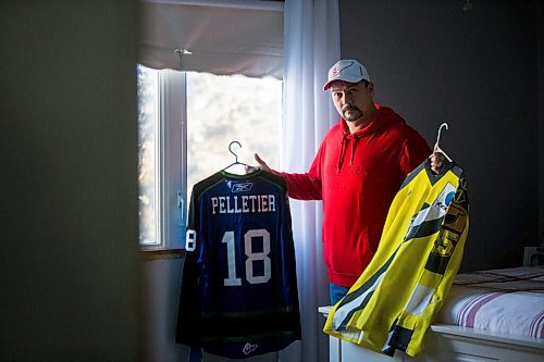 MIKAELA MACKENZIE / WINNIPEG FREE PRESS

Lloyd Pelletier poses for a portrait with a Broncos jersey and a jersey from his time playing in Europe at his home in Lockport on Friday, Dec. 4, 2020. For Jeff Hamilton story.

Winnipeg Free Press 2020