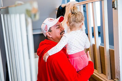 MIKAELA MACKENZIE / WINNIPEG FREE PRESS

Lloyd Pelletier picks up his granddaughter Penelope Sousa (one) at his home in Lockport on Friday, Dec. 4, 2020. For Jeff Hamilton story.

Winnipeg Free Press 2020