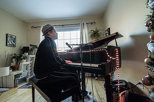 Mike Sudoma / Winnipeg Free Press
Local Pianist, Matt Budoloski, plays the piano in his living room Sunday afternoon. Matt made the switch from playing shows in local bars/lounges to playing to a virtual audience via Facebook early on in the Covid 19 Pandemic as a way to keep up his musical chops as well as provide entertainment to his virtual audience.
December 7, 2020