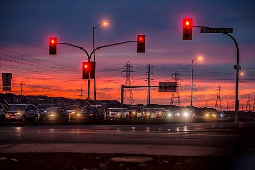 Mike Sudoma / Winnipeg Free Press
Rush hour traffic sits at a red light while the sun sets along Bishop Grandin Boulevard Monday evening
December 7, 2020
