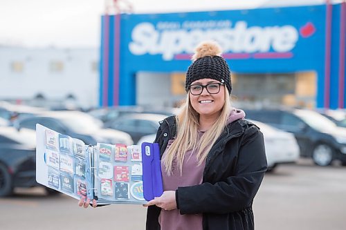 Mike Sudoma / Winnipeg Free Press
Nichole Schaubroeck aka Coupon Cutie holds up her coupon books which feature discounts on all kinds of different stores/items Monday afternoon
December 7, 2020