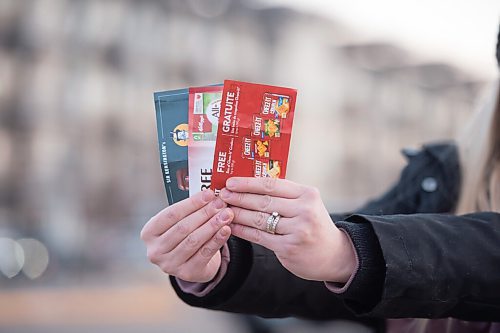 Mike Sudoma / Winnipeg Free Press
Nichole Schaubroeck aka Coupon Cutie holds up her coupon books which feature discounts on all kinds of different stores/items Monday afternoon
December 7, 2020