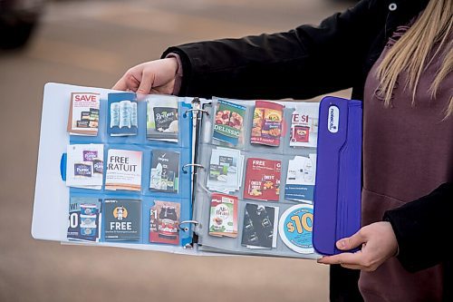 Mike Sudoma / Winnipeg Free Press
Nichole Schaubroeck aka Coupon Cutie holds up her coupon books which feature discounts on all kinds of different stores/items Monday afternoon
December 7, 2020