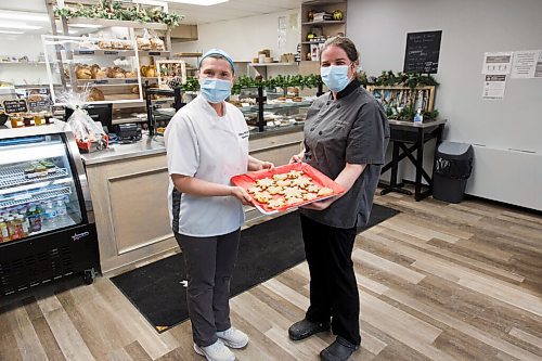 MIKE DEAL / WINNIPEG FREE PRESS
(from left) Kristina Majowski and Shannon MacTavish owners of the White Birch Bakery, Unit B - 1108 Henderson Highway, with their Slovenian Honey Cookies, or Slovenian Medenjaki for the 12 Days of Christmas Cookie feature.
See Alan Small story
201208 - Tuesday, December 08, 2020.