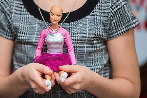 MIKAELA MACKENZIE / WINNIPEG FREE PRESS

Emily Pile, eight, with her Brave Barbie Ella at home in Winnipeg on Wednesday, Dec. 9, 2020. The Brave Barbie dolls are dolls without hair for cancer patients to relate with. For Kellen story.

Winnipeg Free Press 2020