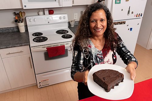 JESSE BOILY  / WINNIPEG FREE PRESS
Ave Dinzey of Purple Hibiscus, shows her Trini Black Cake, a traditional Rum Cake in Trinidad on Wednesday. Wednesday, Dec. 9, 2020.
Reporter: