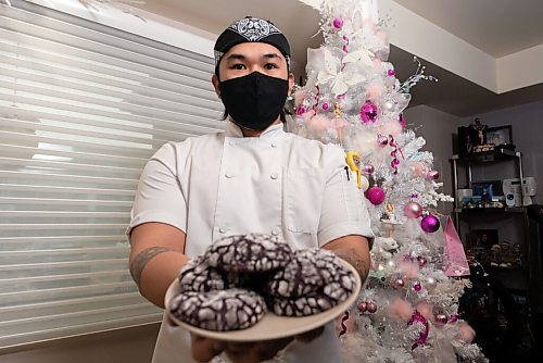JESSE BOILY  / WINNIPEG FREE PRESS
Eejay Chua, a chef at Baon Bistro, shows some of his ube crinkle, a popular Filipino cookie for the holidays at his home on Wednesday. Wednesday, Dec. 9, 2020.
Reporter: