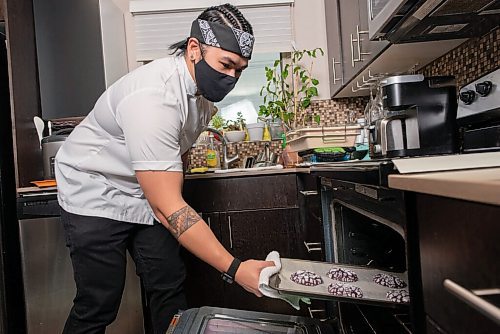 JESSE BOILY  / WINNIPEG FREE PRESS
Eejay Chua, a chef at Baon Bistro, shows some of his ube crinkle, a popular Filipino cookie for the holidays at his home on Wednesday. Wednesday, Dec. 9, 2020.
Reporter: