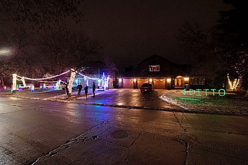 Mike Sudoma / Winnipeg Free Press
Living in the shadow of the Jasper familys Christmas light display, the Paterson family have finally taken over the limelight with their comical DITTO light display in their front yard on Shorecrest Dr, a popular neighbourhood for Christmas decorating.
December 3, 2020
