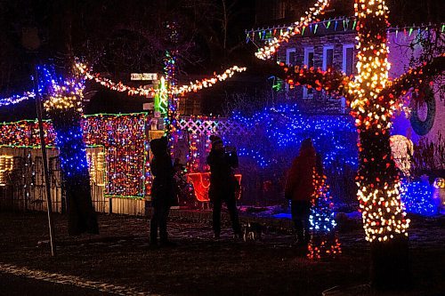 Mike Sudoma / Winnipeg Free Press
Christmas light spectators take photos of the bright and beautiful Christmas light displays along Shorecrest Drive Wednesday evening
December 3, 2020