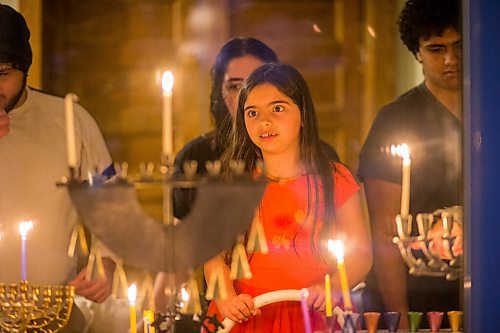 MIKAELA MACKENZIE / WINNIPEG FREE PRESS

Anaya Rose, seven, looks at the menorahs as the family lights candles on the first night of Hanukah in Winnipeg on Thursday, Dec. 10, 2020. Standup.

Winnipeg Free Press 2020