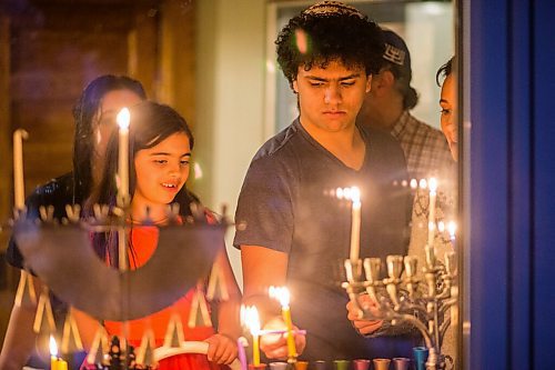 MIKAELA MACKENZIE / WINNIPEG FREE PRESS

Kol Rose, 16, lights candles with his family on the first night of Hanukah in Winnipeg on Thursday, Dec. 10, 2020. Standup.

Winnipeg Free Press 2020