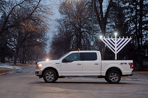 Mike Sudoma / Winnipeg Free Press
A truck mounted with a menorah drives down Mathers Avenue Thursday evening, sharing Chanukah cheer for everyone celebrating inside. The truck is stocked with menorahs and candles to hand out to those who dont have any to celebrate the Chanukah festival with.
December 9, 2020