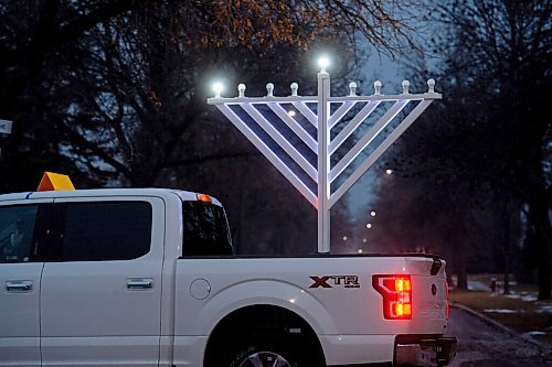 Mike Sudoma / Winnipeg Free Press
A truck mounted with a menorah drives down Mathers Avenue Thursday evening, sharing Chanukah cheer for everyone celebrating inside. The truck is stocked with menorahs and candles to hand out to those who dont have any to celebrate the Chanukah festival with.
December 9, 2020