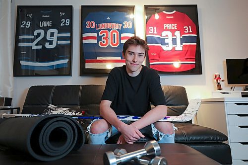 RUTH BONNEVILLE / WINNIPEG FREE PRESS

SPORTS - covid hockey

Portrait of Winnipeg Freeze goaltender, Presley Lester in his basement bad complete with home gym, lounge with hockey memorabilia for feature story on pandemic life for hockey players.


Mike Sawatzky  | Sports Reporter

Dec 11h,. 2020