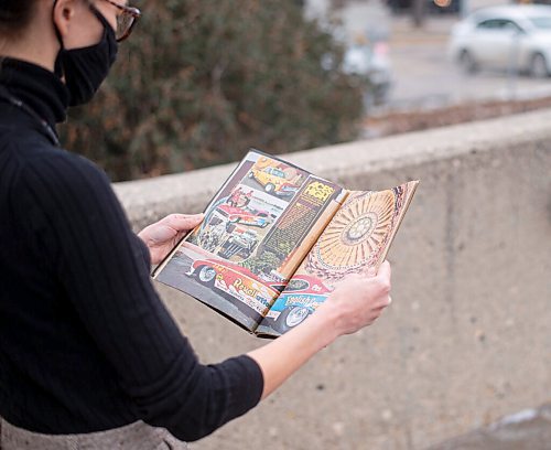 Mike Sudoma / Winnipeg Free Press
St James Public Librarys Head Librarian, Stephanie George, flips through a Car Craft magazine from 1975 that was just returned to the library after being signed out for the past 45 years.
December 11, 2020