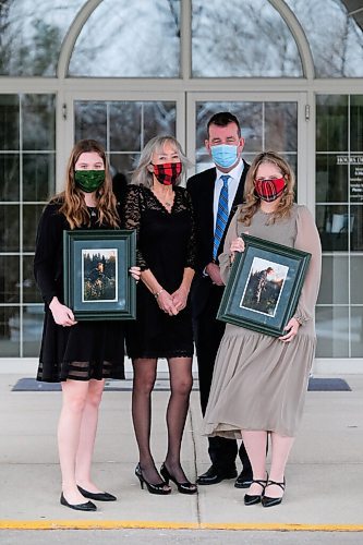Daniel Crump / Winnipeg Free Press. (LtoR) Julia Hobson, Kim Crichton, Scott Crichton and Susan Crichton. The Crichton family poses for a picture at Thomson in the Park funeral home after the funeral of family member Vincent Crichton. December 12, 2020.