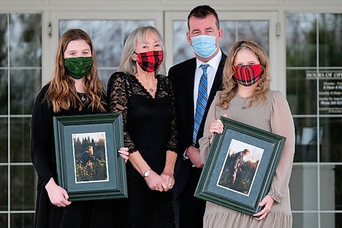 Daniel Crump / Winnipeg Free Press. (LtoR) Julia Hobson, Kim Crichton, Scott Crichton and Susan Crichton. The Crichton family poses for a picture at Thomson in the Park funeral home after the funeral of family member Vincent Crichton. December 12, 2020.