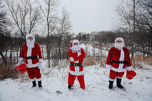 JOHN WOODS / WINNIPEG FREE PRESS
Michael Cheetham, from left, Jason Gray and Lee Jacobson dress as Santa and go around visiting children outside their homes Sunday, December 13, 2020. The friends are collecting food for Harvest Manitoba.

Reporter: Speirs