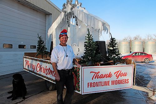 Canstar Community News Corey Bossuyt stands with the miniature float he created using the Knights of Columbus's nativity scene. Volunteers drive the float through Winnipeg daily to spread Christmas cheer. (GABRIELLE PICHÉ/CANSTAR COMMUNITY NEWS/HEADLINER)
