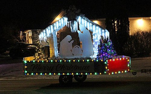 Canstar Community News Christmas music blares at the Knights of Columbus float cruises by. Above, the float travels through Oak Bluff on Dec. 5. (GABRIELLE PICHÉ/CANSTAR COMMUNITY NEWS/HEADLINER)