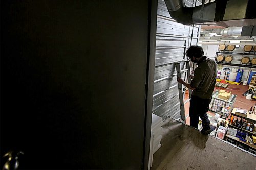 SHANNON VANRAES/WINNIPEG FREE PRESS 
Tom Nagy is the owner and sole-operator of River City Mushrooms on Winnipeg. He was photographed climbing into his loft workshop at Barnhammer Brewing on December 15, 2020.