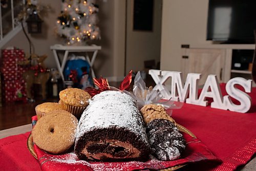 JESSE BOILY  / WINNIPEG FREE PRESS
Denise Comeault shows her Yule log along with some of her other holiday baking treats at her home on Tuesday. Tuesday, Dec. 15, 2020.
Reporter: Alan Small