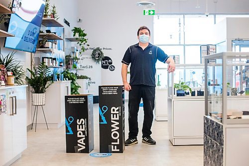 MIKAELA MACKENZIE / WINNIPEG FREE PRESS

Trevor Duncan, Kenaston Delta 9 Cannabis store manager, poses for a portrait with new recycling boxes for cannabis packaging and vape pen cartridges in Winnipeg on Wednesday, Dec. 16, 2020. For Nicole Brownlee story.

Winnipeg Free Press 2020