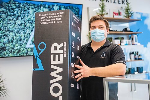 MIKAELA MACKENZIE / WINNIPEG FREE PRESS

Trevor Duncan, Kenaston Delta 9 Cannabis store manager, poses for a portrait with new recycling boxes for cannabis packaging and vape pen cartridges in Winnipeg on Wednesday, Dec. 16, 2020. For Nicole Brownlee story.

Winnipeg Free Press 2020