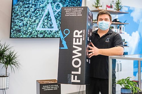 MIKAELA MACKENZIE / WINNIPEG FREE PRESS

Trevor Duncan, Kenaston Delta 9 Cannabis store manager, poses for a portrait with new recycling boxes for cannabis packaging and vape pen cartridges in Winnipeg on Wednesday, Dec. 16, 2020. For Nicole Brownlee story.

Winnipeg Free Press 2020