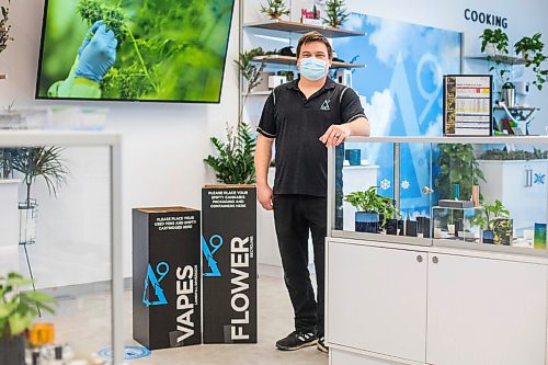 MIKAELA MACKENZIE / WINNIPEG FREE PRESS

Trevor Duncan, Kenaston Delta 9 Cannabis store manager, poses for a portrait with new recycling boxes for cannabis packaging and vape pen cartridges in Winnipeg on Wednesday, Dec. 16, 2020. For Nicole Brownlee story.

Winnipeg Free Press 2020