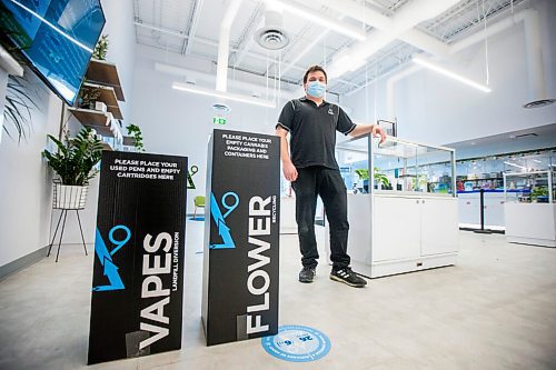 MIKAELA MACKENZIE / WINNIPEG FREE PRESS

Trevor Duncan, Kenaston Delta 9 Cannabis store manager, poses for a portrait with new recycling boxes for cannabis packaging and vape pen cartridges in Winnipeg on Wednesday, Dec. 16, 2020. For Nicole Brownlee story.

Winnipeg Free Press 2020