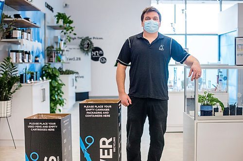 MIKAELA MACKENZIE / WINNIPEG FREE PRESS

Trevor Duncan, Kenaston Delta 9 Cannabis store manager, poses for a portrait with new recycling boxes for cannabis packaging and vape pen cartridges in Winnipeg on Wednesday, Dec. 16, 2020. For Nicole Brownlee story.

Winnipeg Free Press 2020