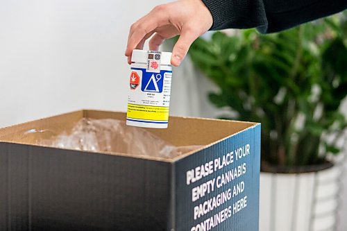 MIKAELA MACKENZIE / WINNIPEG FREE PRESS

An example of recyclable packaging is held over new recycling boxes for cannabis packaging and vape pen cartridges at the Kenaston Delta 9 Cannabis store in Winnipeg on Wednesday, Dec. 16, 2020. For Nicole Brownlee story.

Winnipeg Free Press 2020