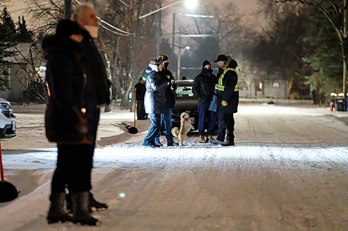 Daniel Crump / Winnipeg Free Press. Neighbours stand at the ends of their driveways to listen to a curb-side Christmas concert on Bowhill Lane in Charleswood. The Christmas themed concert is part of a series masterminded by Dan Scramstad and Pierre Freyter as a way of spreading joy this holiday season. December 16, 2020.