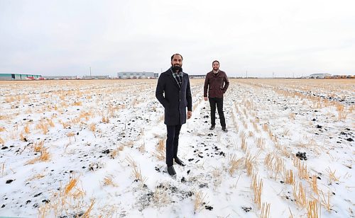 RUTH BONNEVILLE / WINNIPEG FREE PRESS

BIZ - Whiteland

Photo of Whiteland Developers CEO Paul Jhand (front, blue) and President Sam Sidhu on the open land next to InksPort industrial park at CentrePort,  where they are investing $65 million in the  industrial park. They are doubling down on the groups already-sizeable investment in industrial real estate.

President Sam Sidhu and CEO Paul Jhand say the industrial future of the park gave them confidence to make the commitment. 

Ben Waldman story. 

Dec 17h,. 2020