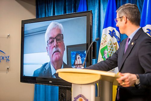 MIKAELA MACKENZIE / WINNIPEG FREE PRESS

Jim Bell, CEO of Siloam Mission, speaks about the Rapid Housing Initiative funding as mayor Brian Bowman listens at City Hall in Winnipeg on Friday, Dec. 18, 2020.  For Dylan Robertson story.

Winnipeg Free Press 2020