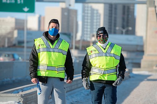 Mike Sudoma / Winnipeg Free Press
Debra Kutcher and Shivam Moudgill of the community group, St Boniface Citizens on Patrol walk along the Norwood Bridge Friday afternoon
December 18, 2020