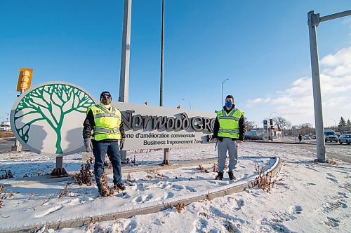 Mike Sudoma / Winnipeg Free Press
Debra Kutcher (left) and Shivam Moudgill (right) of the community group, St Boniface Citizens in front of the Norwood Grove Biz sign, one of the groups sponsors Friday afternoon
December 18, 2020