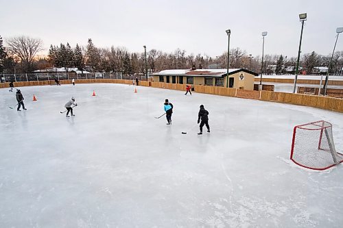 Daniel Crump / Winnipeg Free Press. Groups who booked ice time at Roblin Park Community Centre skate on separate halls of the rink. December 19, 2020.