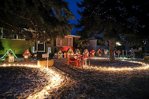 Daniel Crump / Winnipeg Free Press. A small village complete with school, record shop and other amenities makes up the holiday light display at 242 Lockwood Street. December 19, 2020.