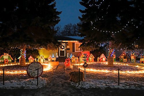 Daniel Crump / Winnipeg Free Press. A small village complete with school, record shop and other amenities makes up the holiday light display at 242 Lockwood Street. December 19, 2020.