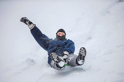 MIKAELA MACKENZIE / WINNIPEG FREE PRESS

Richard Wesley rides down the toboggan hill at Assiniboine Park in Winnipeg on Monday, Dec. 21, 2020.  Standup.

Winnipeg Free Press 2020