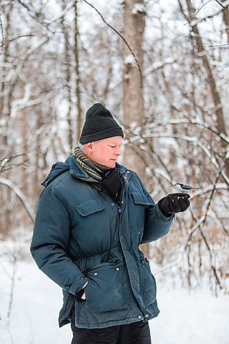 MIKAELA MACKENZIE / WINNIPEG FREE PRESS

Allan Robertson feeds the birds sunflower seeds after a fresh snowfall at Assiniboine Park in Winnipeg on Monday, Dec. 21, 2020.  He's come to the park to feed the nuthatches and chickadees for six years. Standup.

Winnipeg Free Press 2020