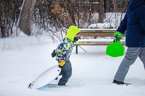 MIKAELA MACKENZIE / WINNIPEG FREE PRESS

River Wesley, six, walks up to the toboggan hill at Assiniboine Park in Winnipeg on Monday, Dec. 21, 2020.  Standup.

Winnipeg Free Press 2020