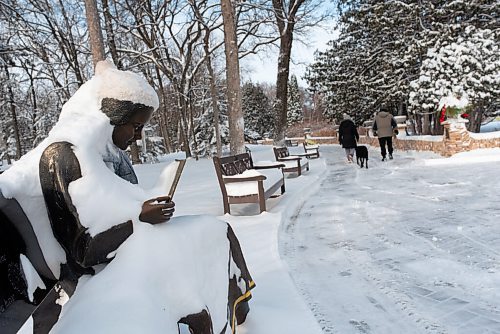 JESSE BOILY  / WINNIPEG FREE PRESS
Fresh snow piles up on a statue as people walk by on the recently cleared trails at Assiniboine Park on Monday. Monday, Dec. 21, 2020.
Reporter:Standup