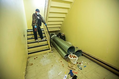 MIKAELA MACKENZIE / WINNIPEG FREE PRESS

Dave Comeau, who has moved in with his mother as he fears for her safety, shows a dirty stairwell where squatters frequent at St. Andrew's Place seniors (55+) residence in Winnipeg on Monday, Dec. 21, 2020. 

Winnipeg Free Press 2020