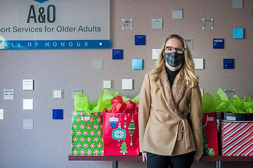 MIKAELA MACKENZIE / WINNIPEG FREE PRESS

Amanda Macrae, CEO of A & O: Support Services for Older Adults, poses for a portrait with gifts for older Manitobans at the organization's office in Winnipeg on Wednesday, Dec. 23, 2020. For Aaron Epp story.

Winnipeg Free Press 2020