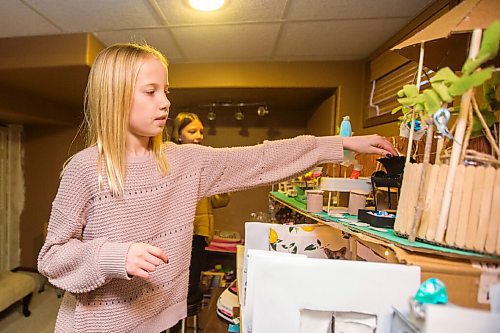 MIKAELA MACKENZIE / WINNIPEG FREE PRESS

Grace Rhodes, 10 (front), and Isla Monro, 11, show the detail on the rooftop patio of their Barbie house made of recycled materials in Winnipeg on Thursday, Dec. 24, 2020. For Maggie Macintosh story.

Winnipeg Free Press 2020