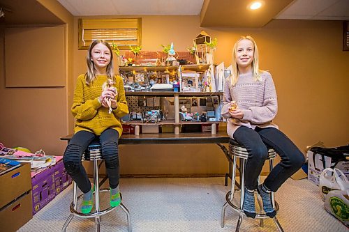 MIKAELA MACKENZIE / WINNIPEG FREE PRESS

Isla Monro, 11 (left), and Grace Rhodes, 10, pose for a portrait in front of their Barbie house made of recycled materials in Winnipeg on Thursday, Dec. 24, 2020. For Maggie Macintosh story.

Winnipeg Free Press 2020